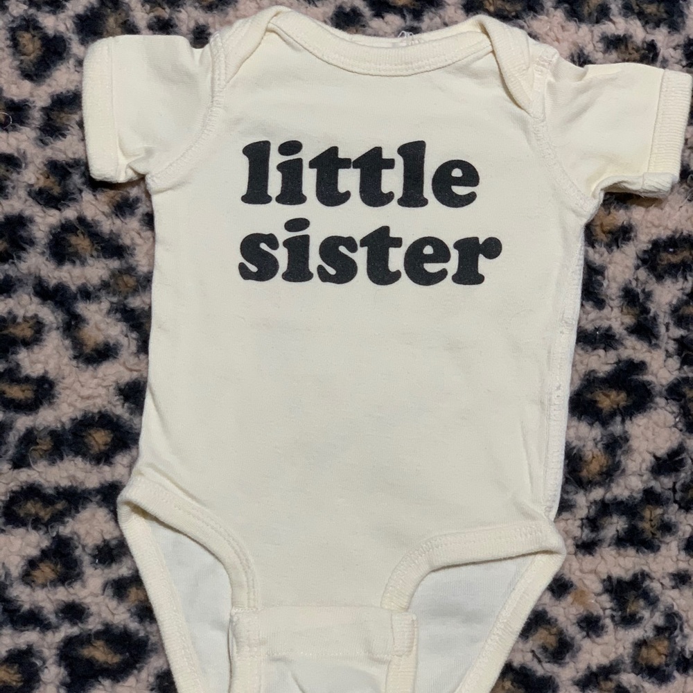 The Wild One shop “little Sister” NB onesie